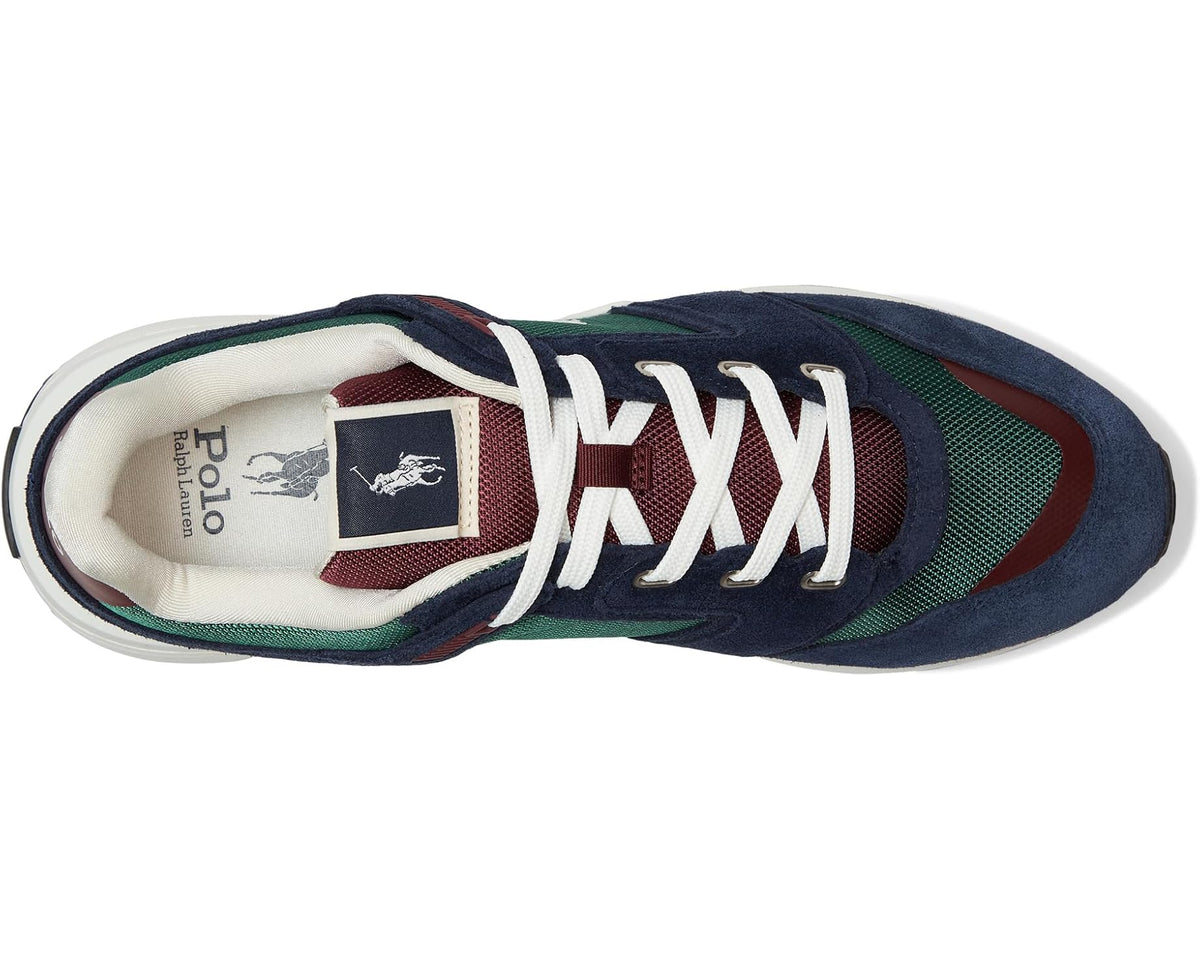 Sneaker interior view with white laces, Polo tongue patch, navy and green uppers.