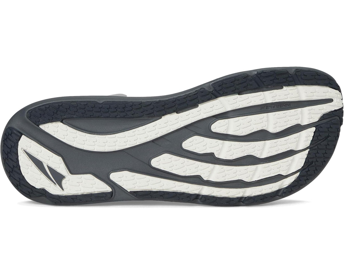 Men's running shoe outsole with dark tread pattern and light center grooves