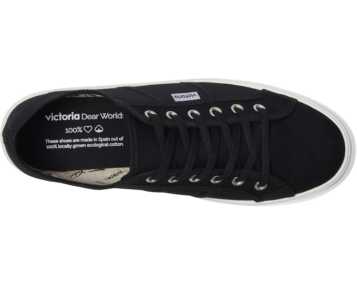 Black canvas sneaker interior with lace-up eyelets and printed insole label