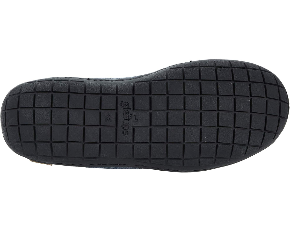 Denim-blue wool boot with black rubber tread outsole, underside view