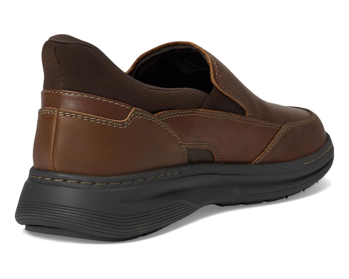 Brown leather slip-on shoe with heel pull tab, padded collar, and rubber sole
