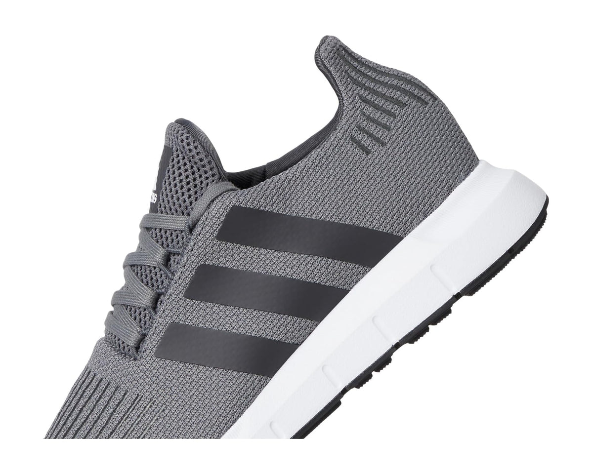 Men's grey knit adidas sneakers with diagonal stripe overlays and white midsole