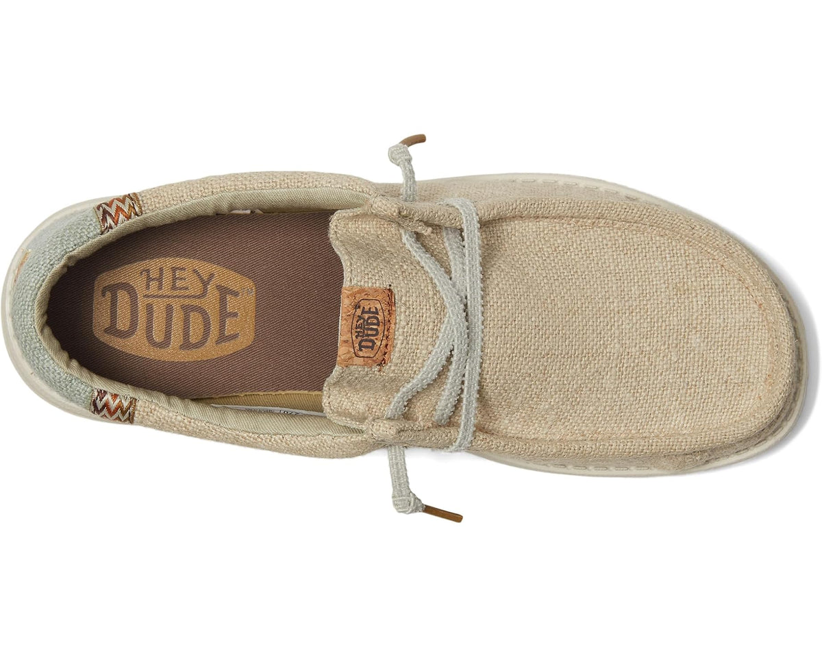 Men's Hey Dude slip-on shoe interior view, fabric upper and Hey Dude logo heel lining