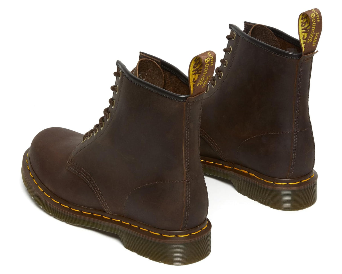 Pair of dark brown leather lace-up boots with yellow welt stitching and low heel