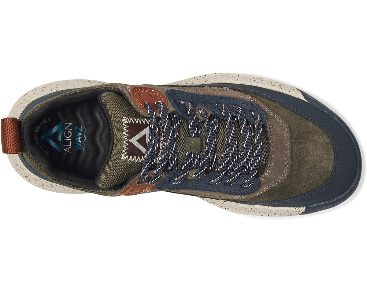 Men's green and navy sneaker side view with textured laces and cushioned collar