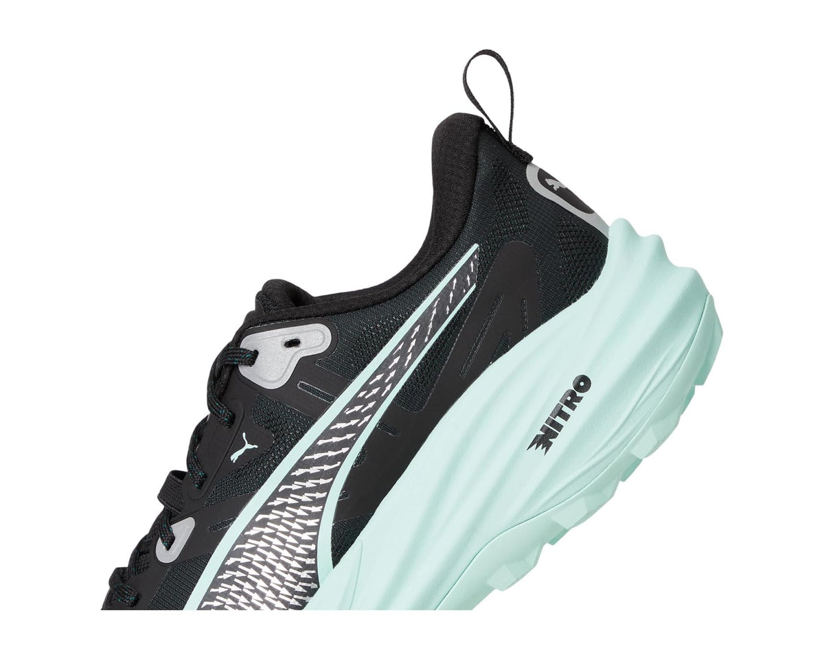 Men's trail running shoe angled side view: black upper, mint midsole, Nitro text
