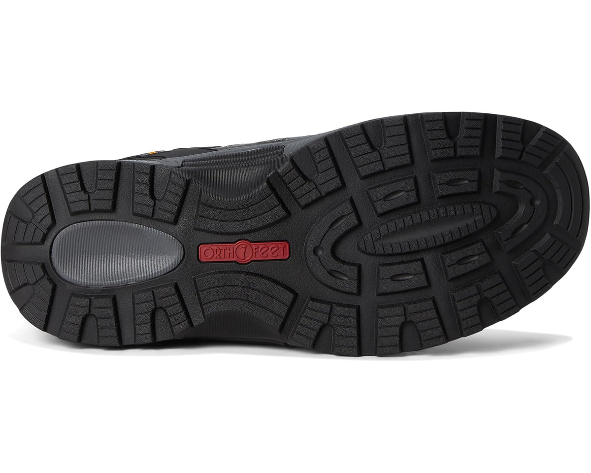 Rubber outsole of gray and black lace-up athletic shoe with traction tread and Orthofeet tag