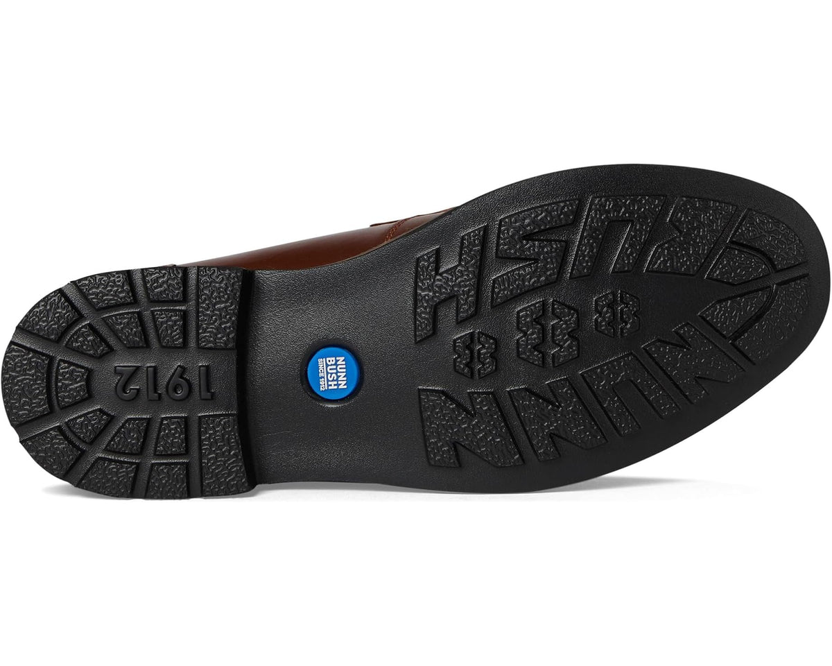 Cognac penny loafer outsole with textured tread and brand markings