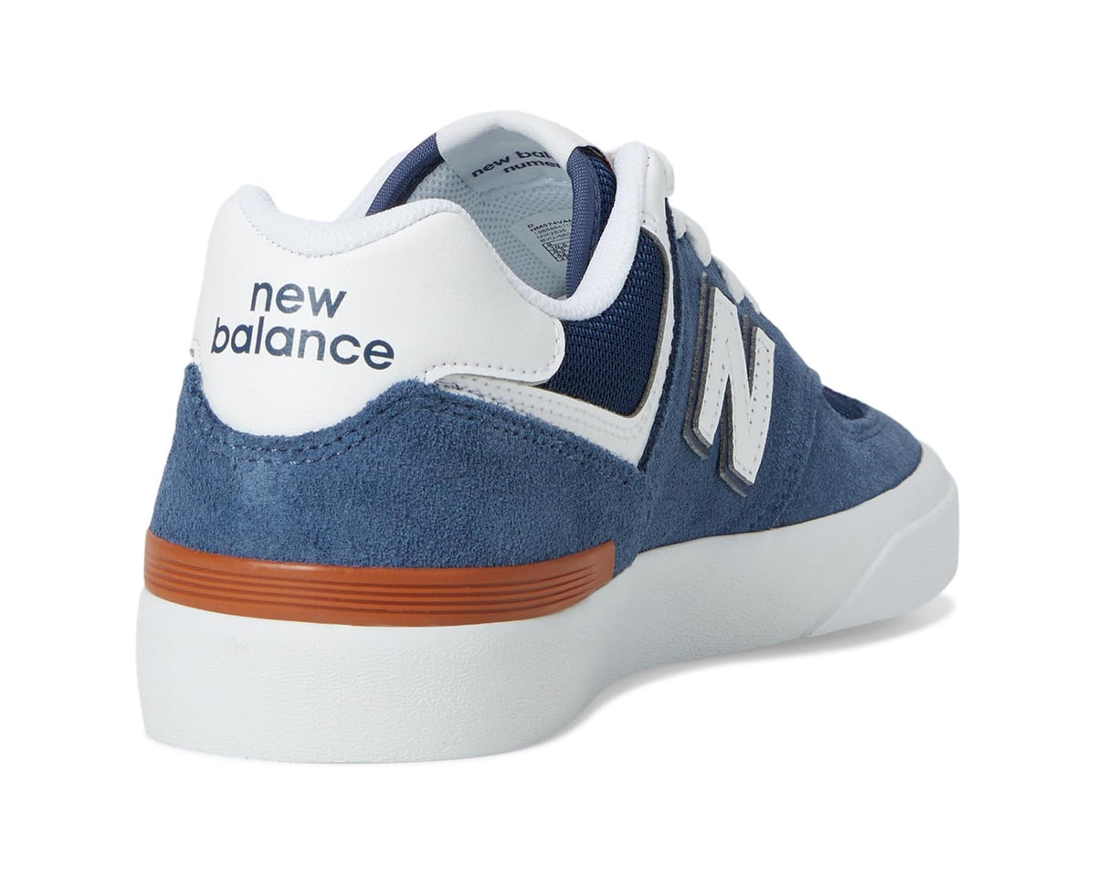 Indigo and white sneakers with rear logo, padded collar, and gum-orange heel stripe