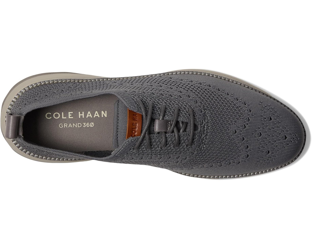 Men's Cole Haan lace-up oxford showing insole label and dark gray knit upper