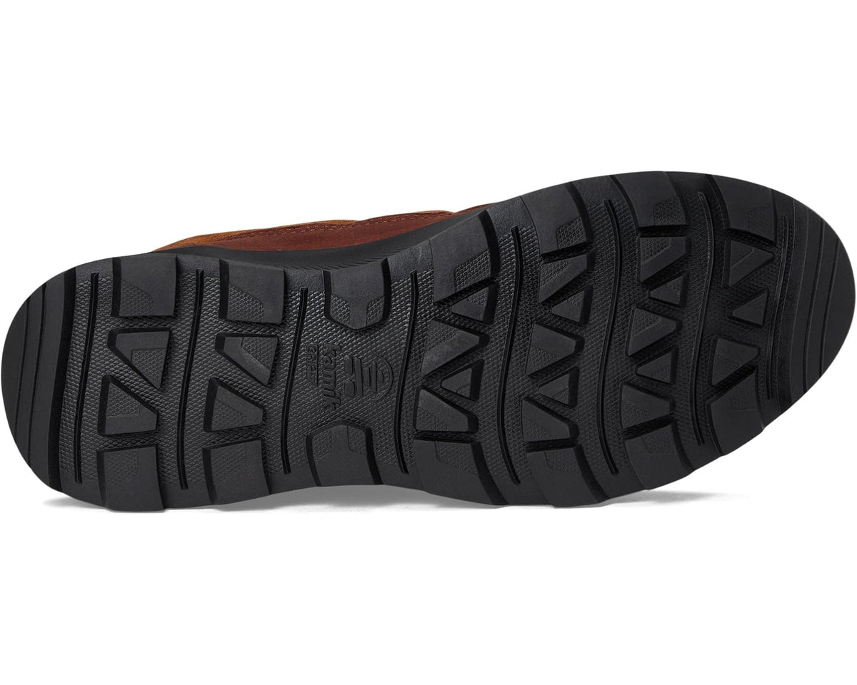 Brown boot outsole with deep tread and textured black rubber pattern
