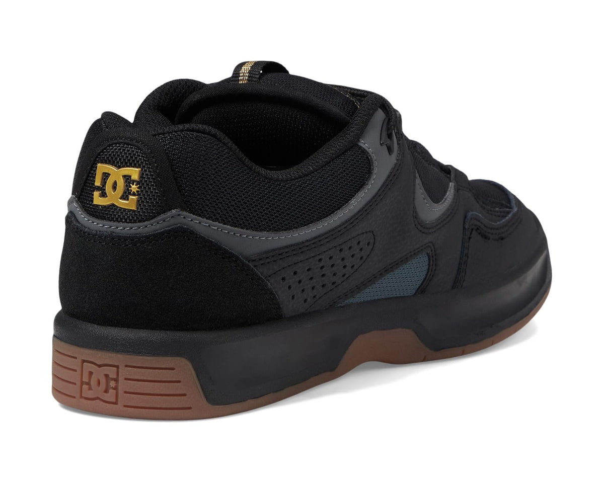 Men's black DC sneakers with gold logo on heel and dark rubber cup sole