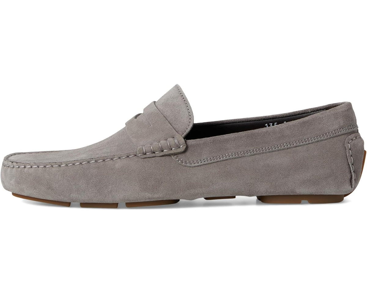Grey suede men's slip-on loafer with stitched strap across instep and low sole