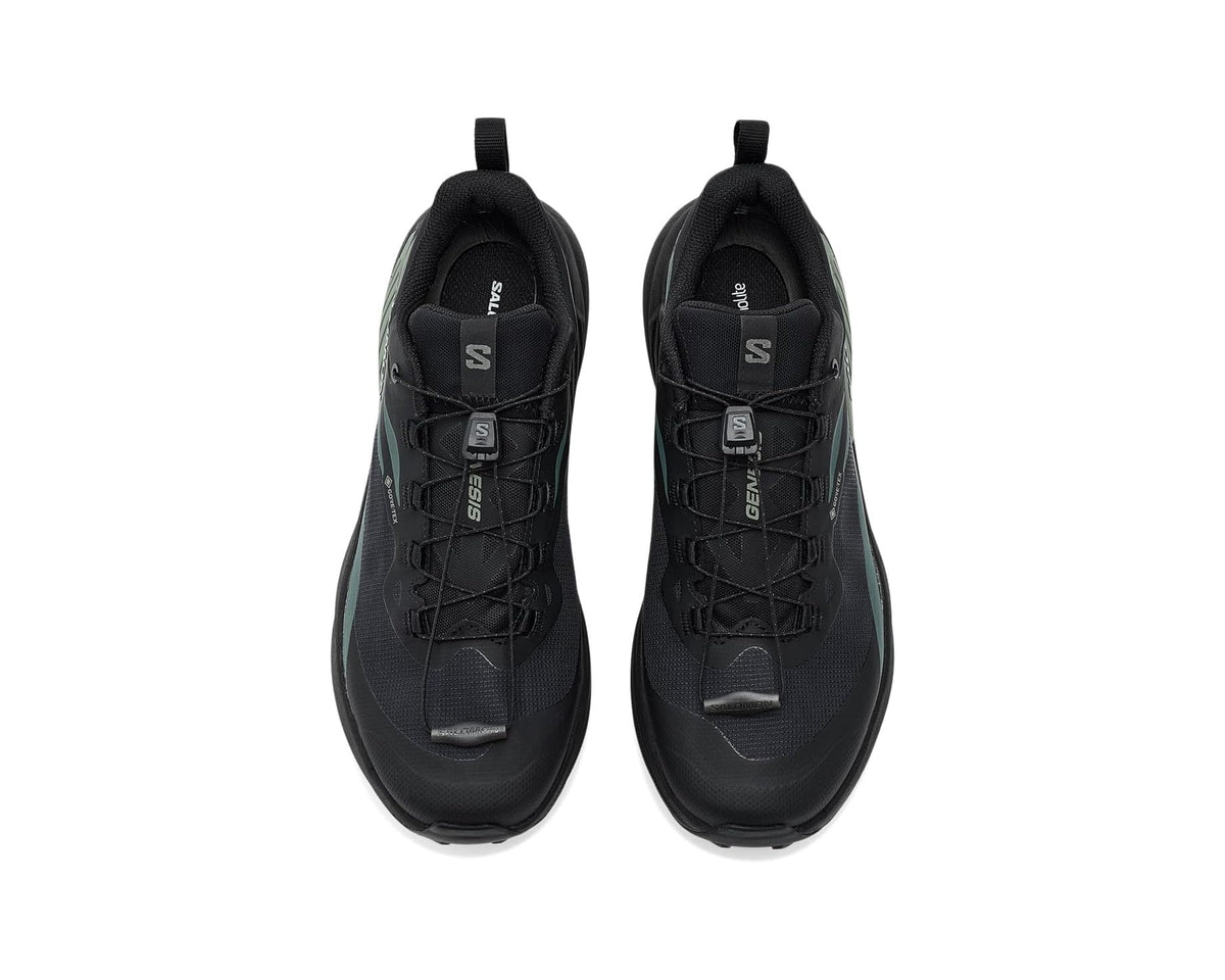 Pair of men's Salomon Genesis shoes, black uppers with green side details