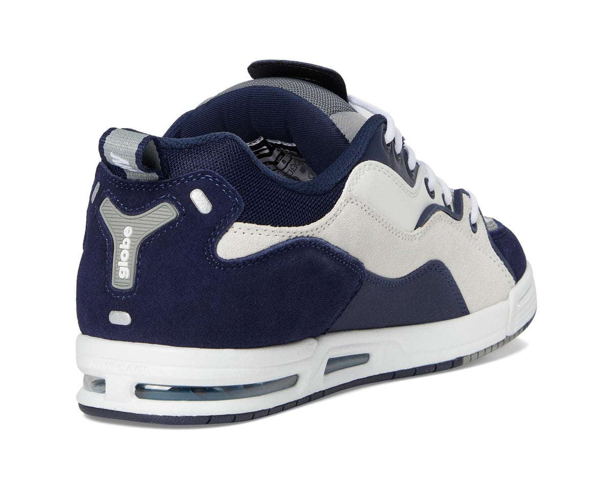 Men's navy and white sneakers with padded collar, lace-up top, and heel tab
