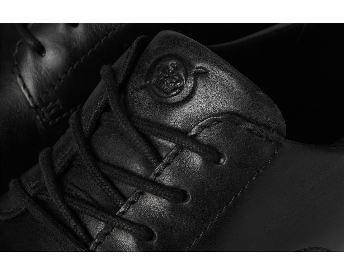 Men's Born Todd black leather lace-up close-up with embossed logo detail