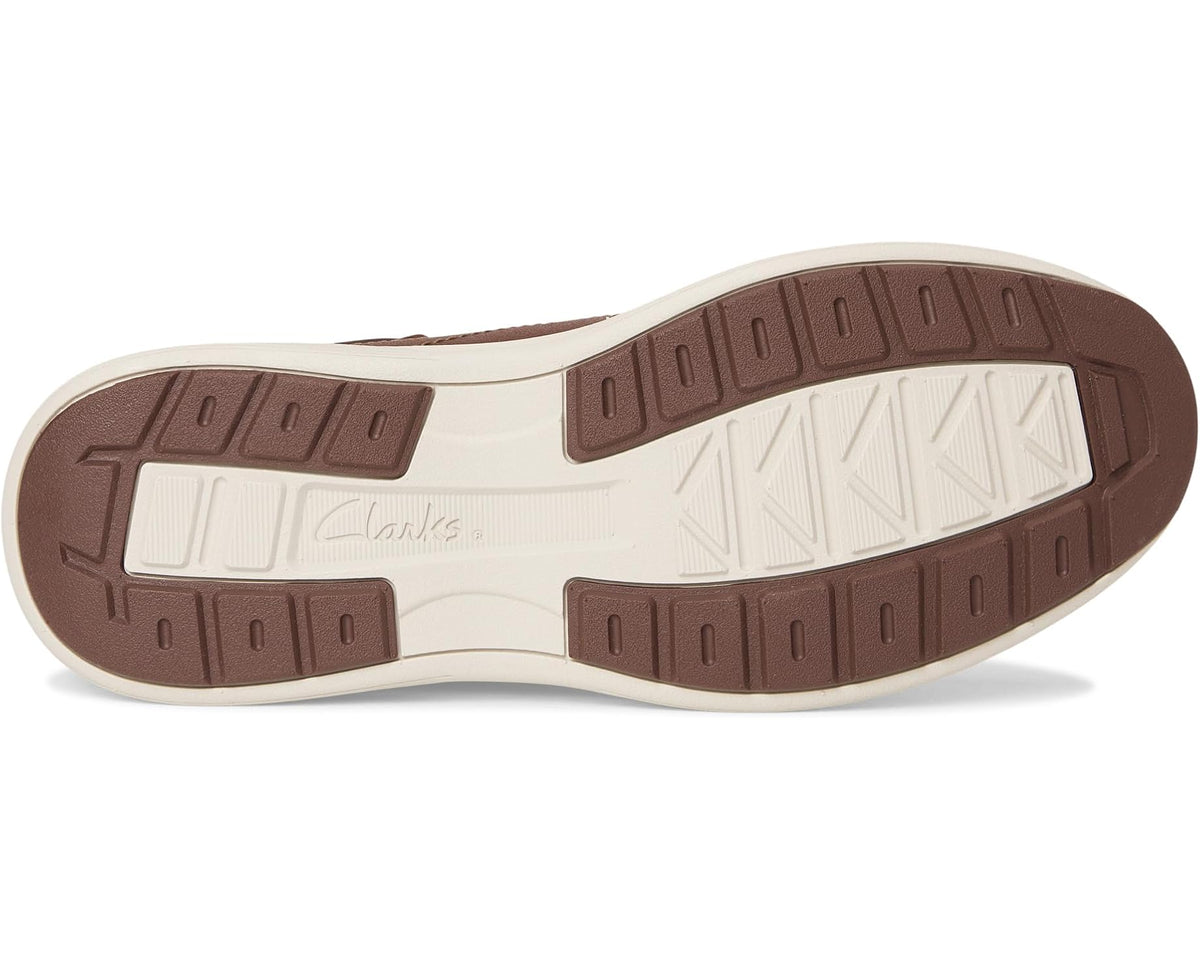 Men’s brown leather boot outsole with molded tread and white midsole