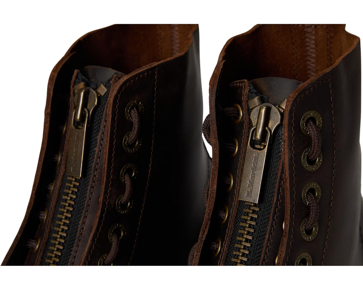 Dark brown leather boot detail: side zipper, lace eyelets, and metal zipper pull.
