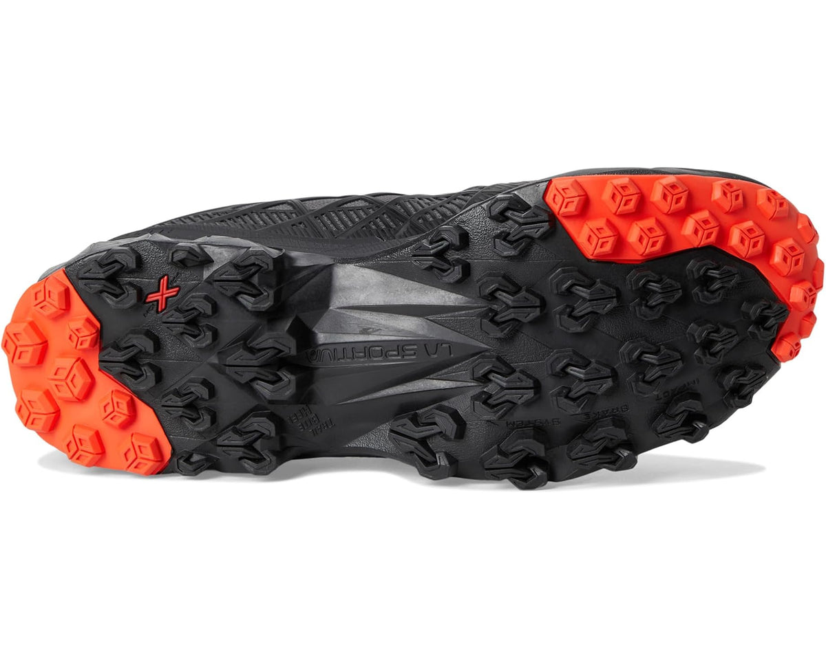 La Sportiva trail shoe outsole view, black tread with bright orange grip lugs