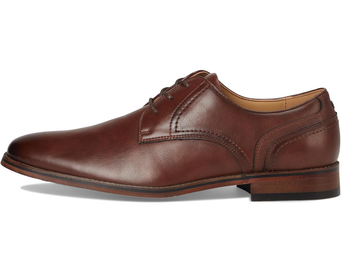 Men's medium brown leather lace-up oxford shoes, side profile with stitched panels