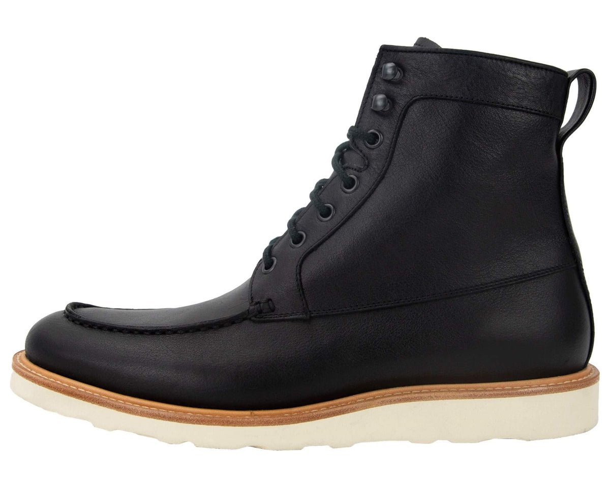 Black mid-calf leather boot with lace-up closure and cream rubber sole