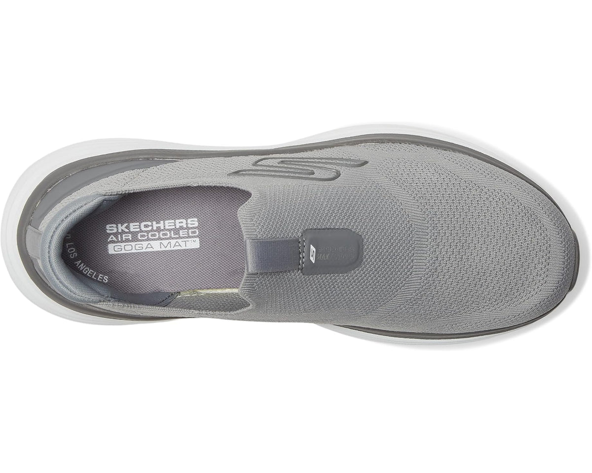 Gray mesh sneaker outsole view with SKECHERS logo on the insole and heel