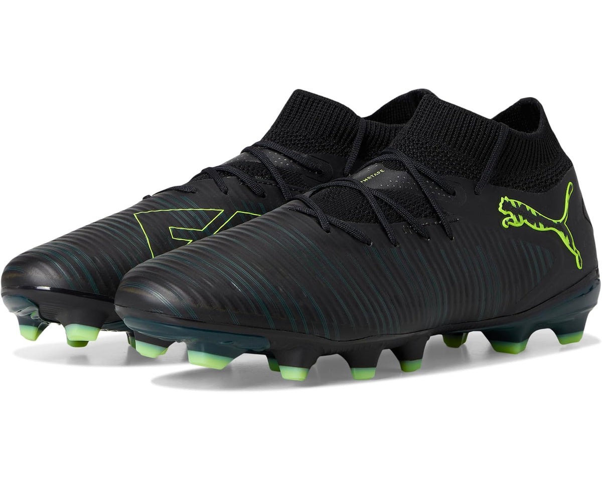 Black soccer cleats with green PUMA logo, firm-ground studs, textured knit collar