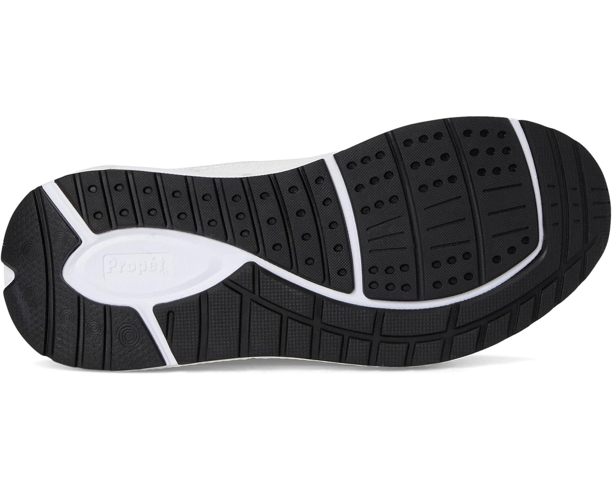 White sneaker outsole with patterned traction tread and black rubber panels