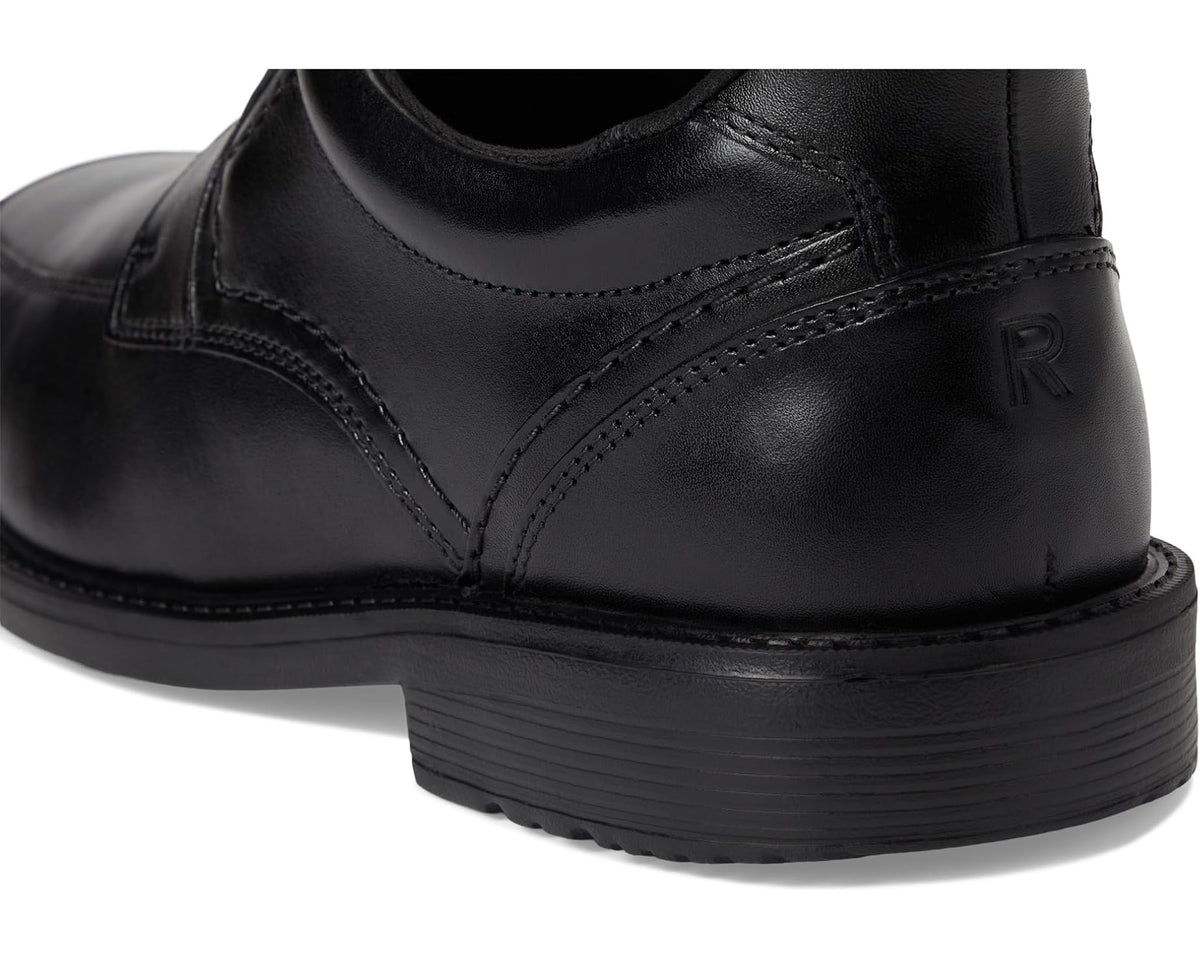 Black leather lace-up shoe back view with stitched panels and textured sole