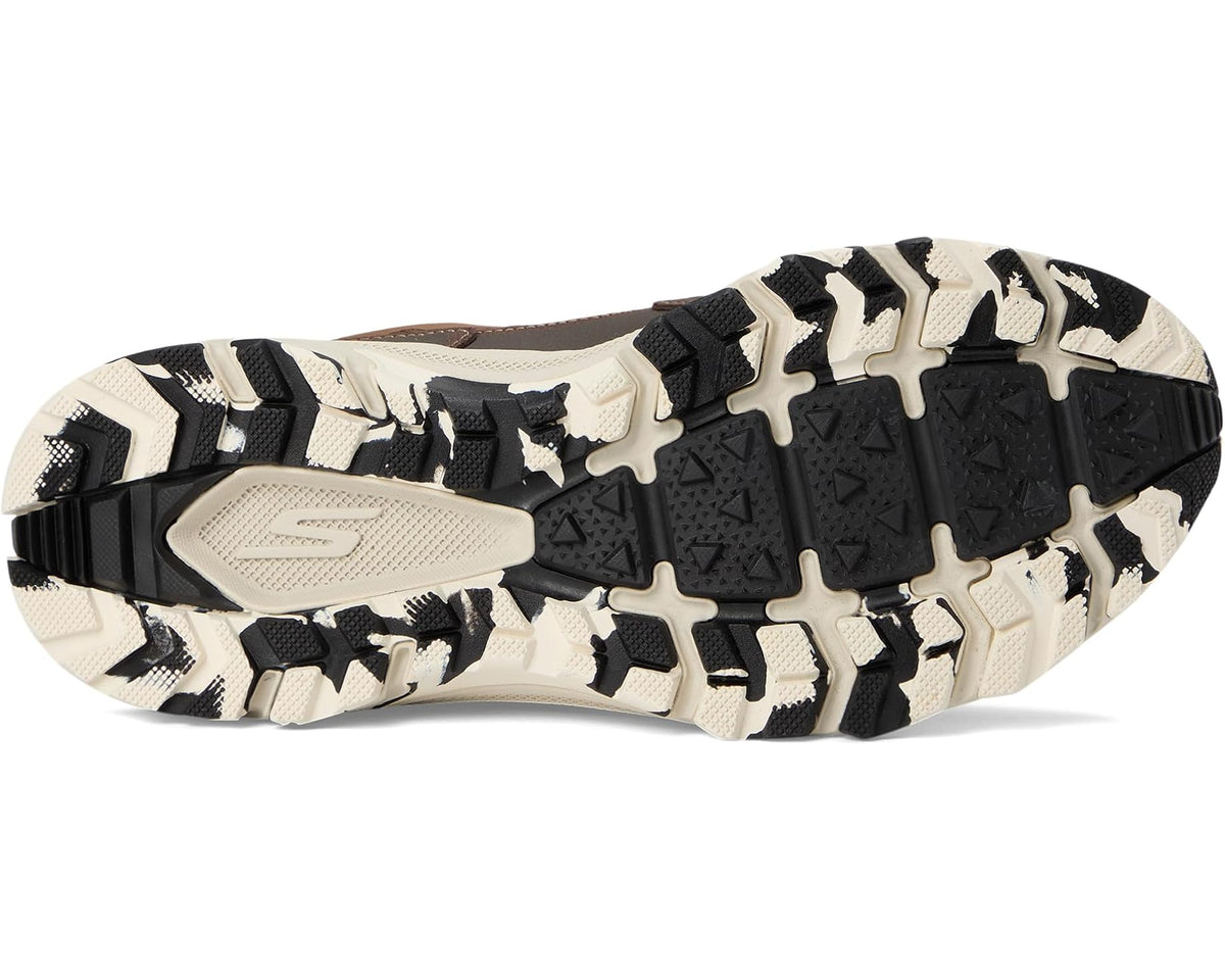 Trail sneaker outsole with white and black rugged tread and cushioned midsole