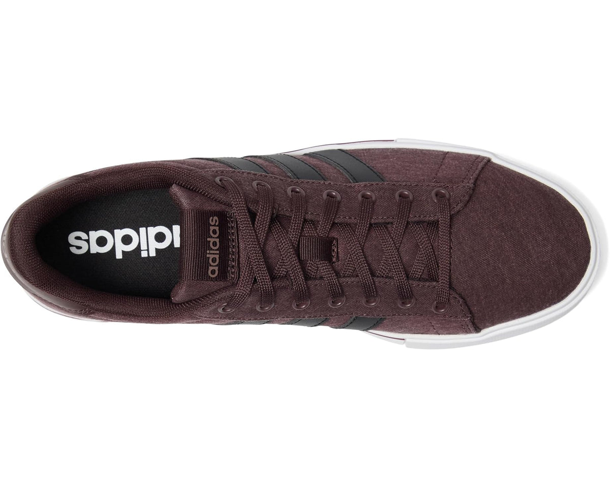 Unisex adidas lace-up sneakers with dark brown upper, black tongue label, and white sole edge