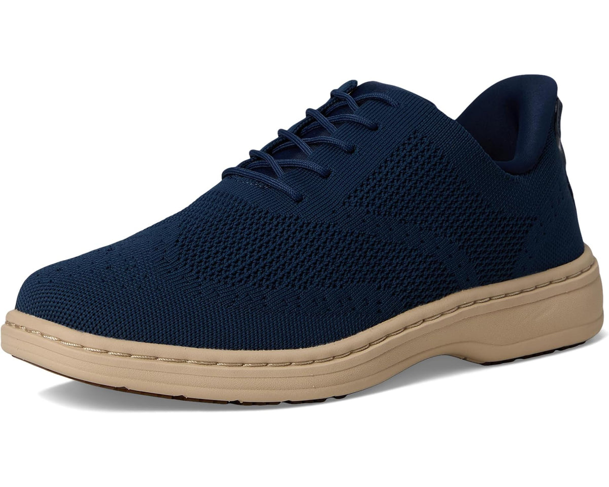 Blue lace-up knit sneaker angled side view with beige cushioned sole