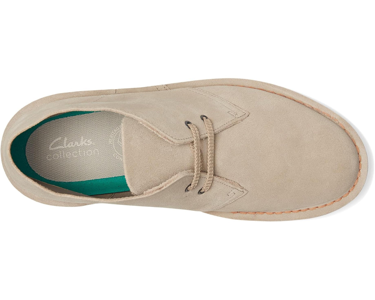 Sand suede desert boot showing interior lining and lace-up eyelets.