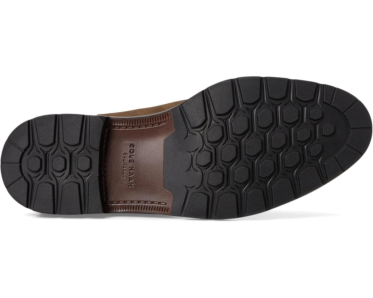 Chelsea boot outsole view with textured tread and padded heel for grip