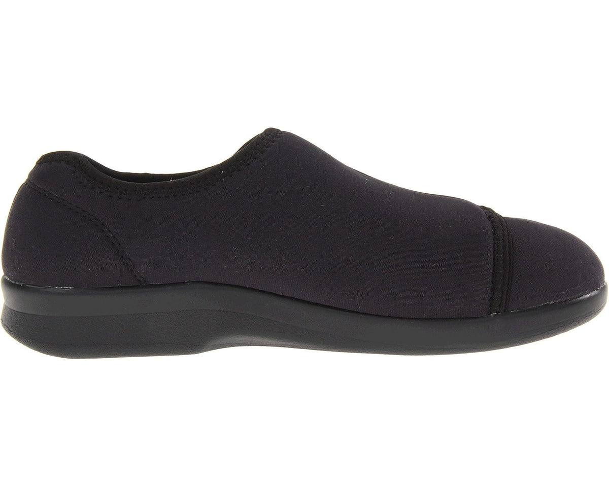 Black slip-on shoe side profile with low-profile rubber sole