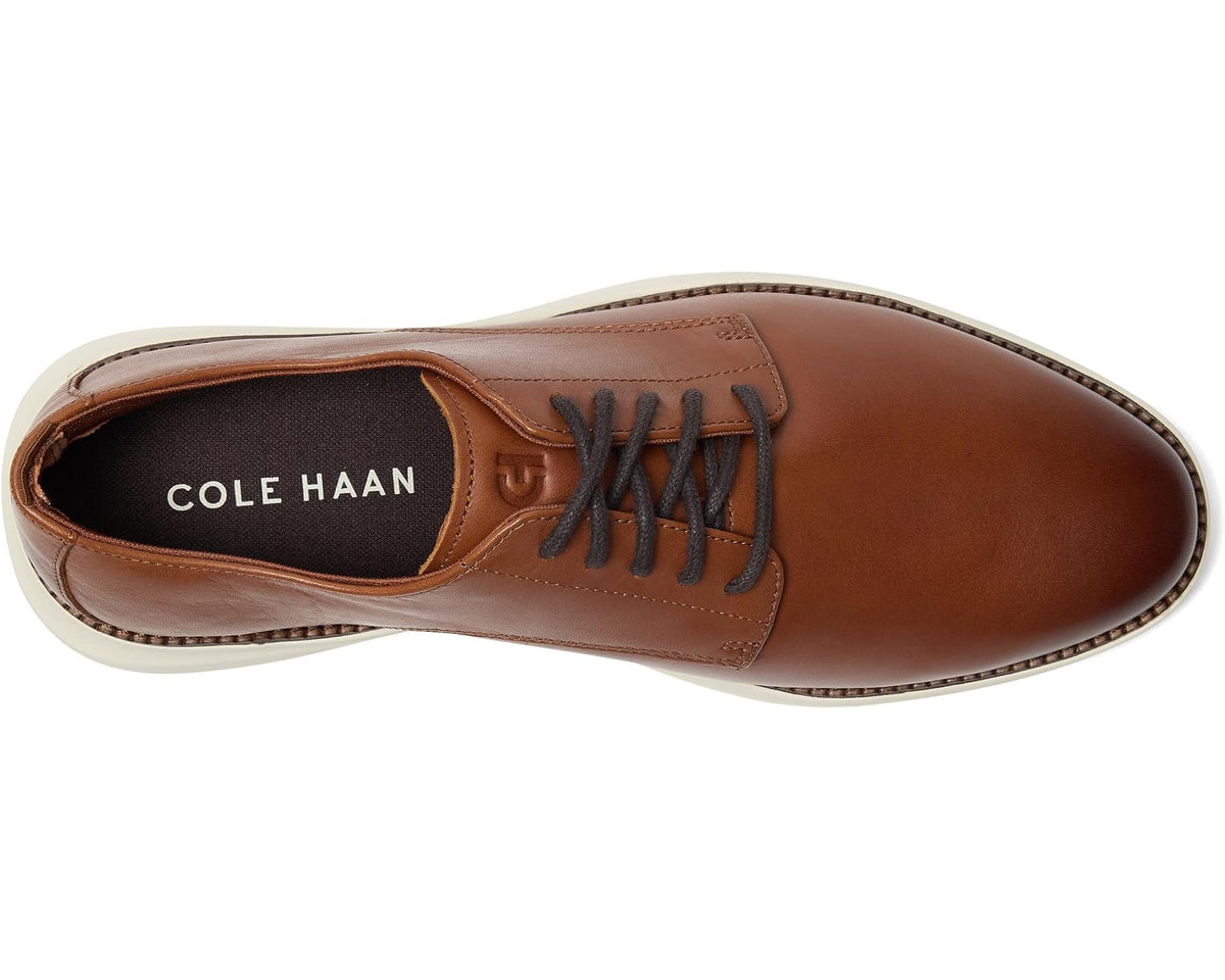 Brown Oxford shoe with lace-up front and Cole Haan logo on lining