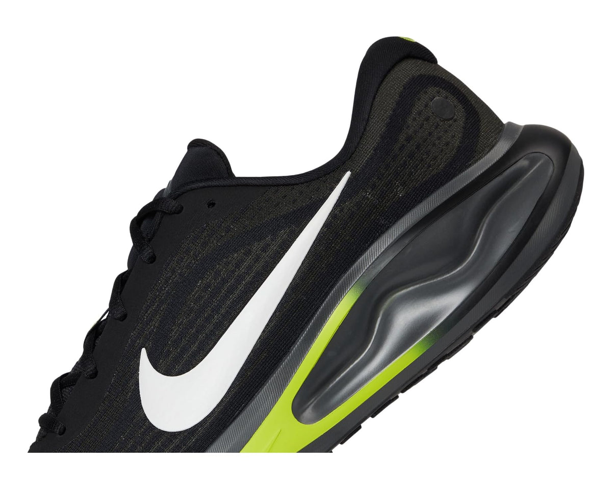 Black mesh running shoe with white swoosh and neon green midsole highlight