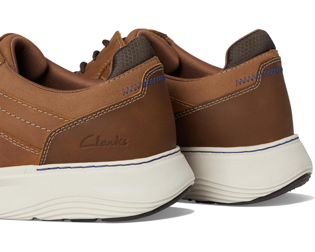 Men's dark tan leather sneaker rear side view with cushioned sole and Clarks logo