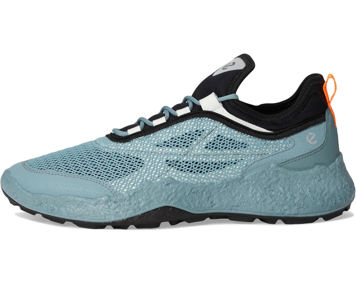 Sky-blue mesh golf shoe with black tongue, teal laces, and low-profile tread