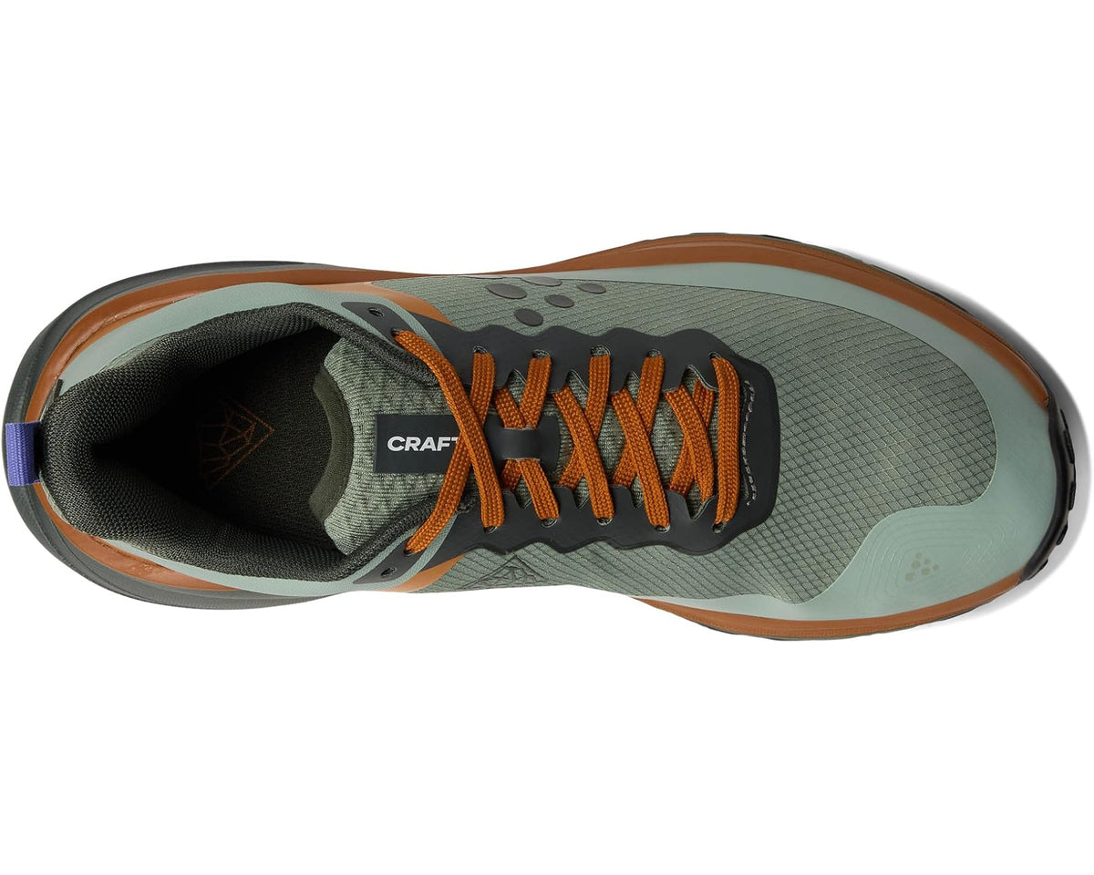 Men's trail shoe showing lace-up front and cushioned lining in teal and black