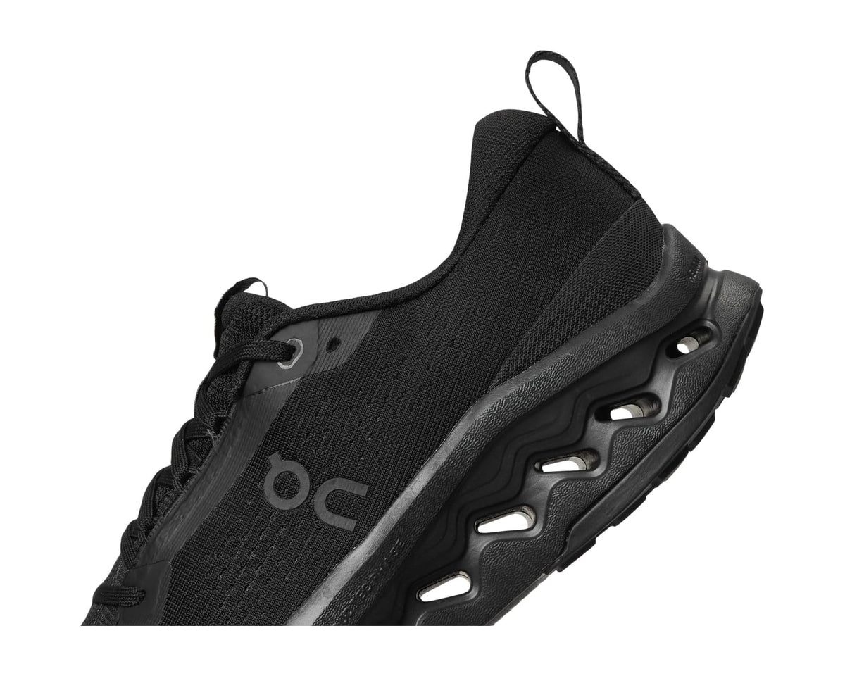 Men's black trail running shoe side close-up with On logo and sole detail