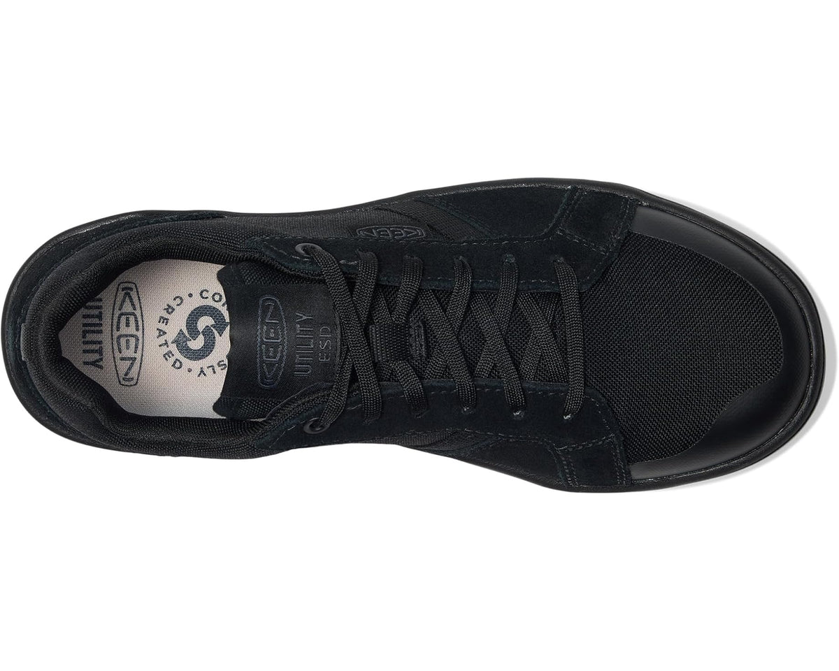 Black KEEN soft-toe work shoe, interior view with lace eyelets and ESD label.
