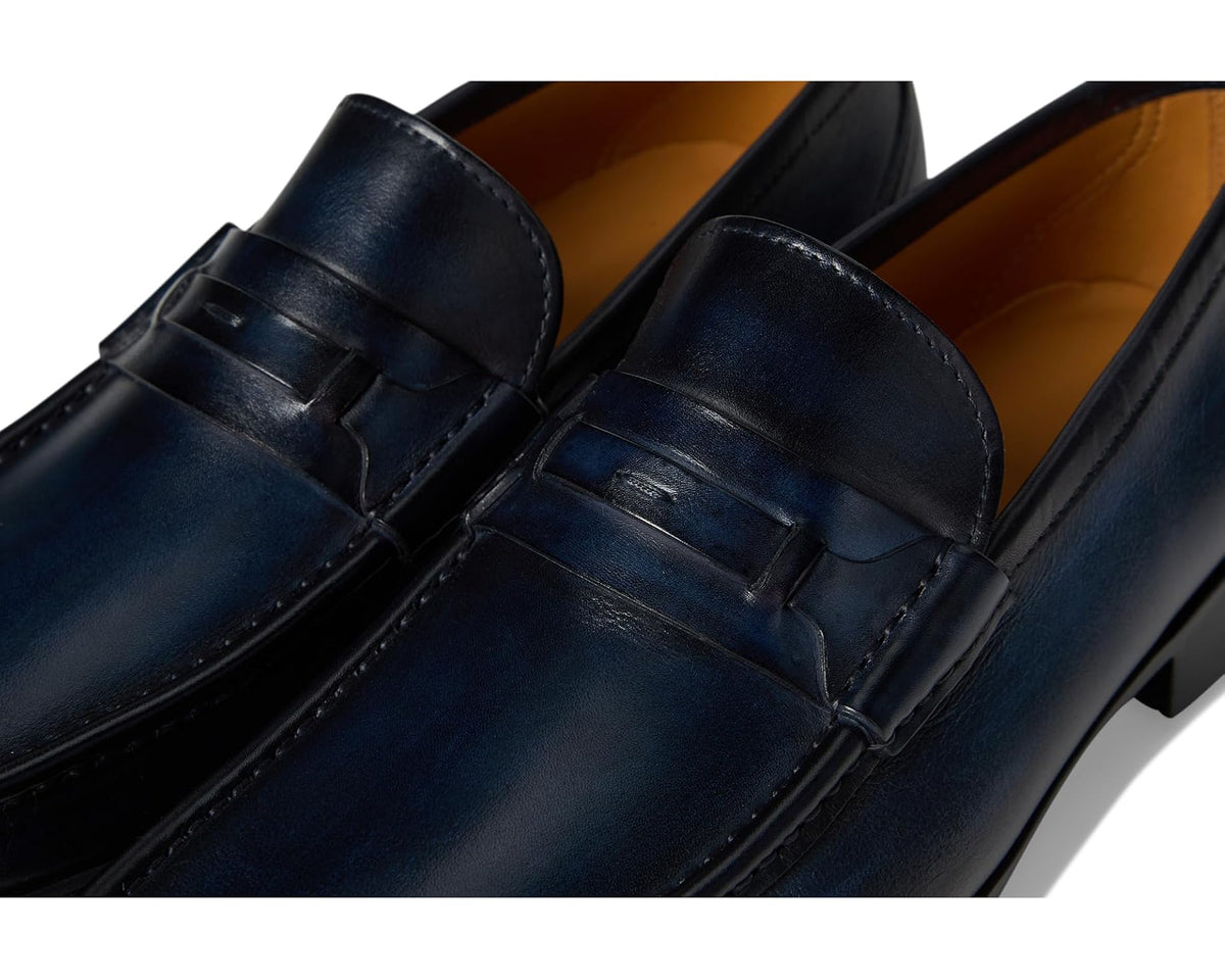 Close-up of navy leather loafer vamp strap and stitching details