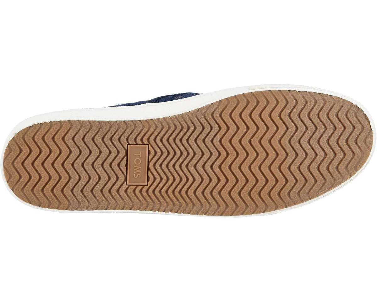 Men's TOMS navy slip-on sneaker outsole tread with TOMS label