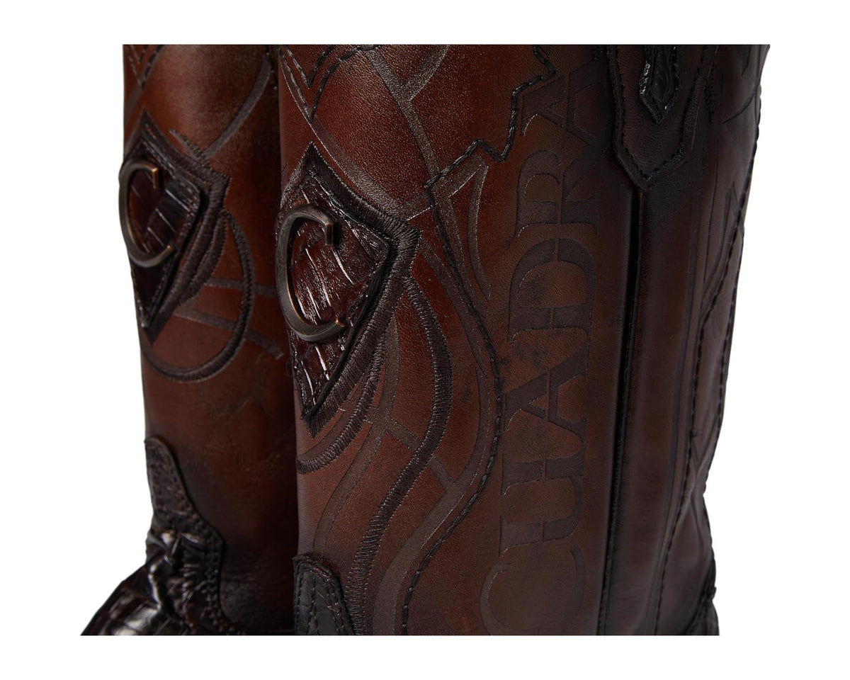 Men's Cuadra cowboy boot shaft close-up with embossed pattern and contrast stitching.