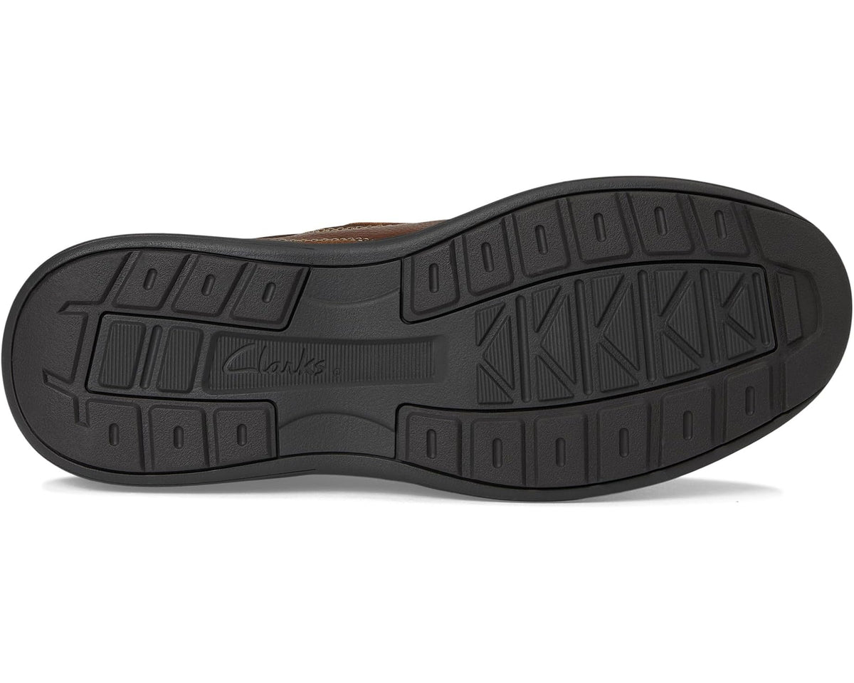 Clarks brown slip-on shoe outsole with traction tread and molded rubber panels