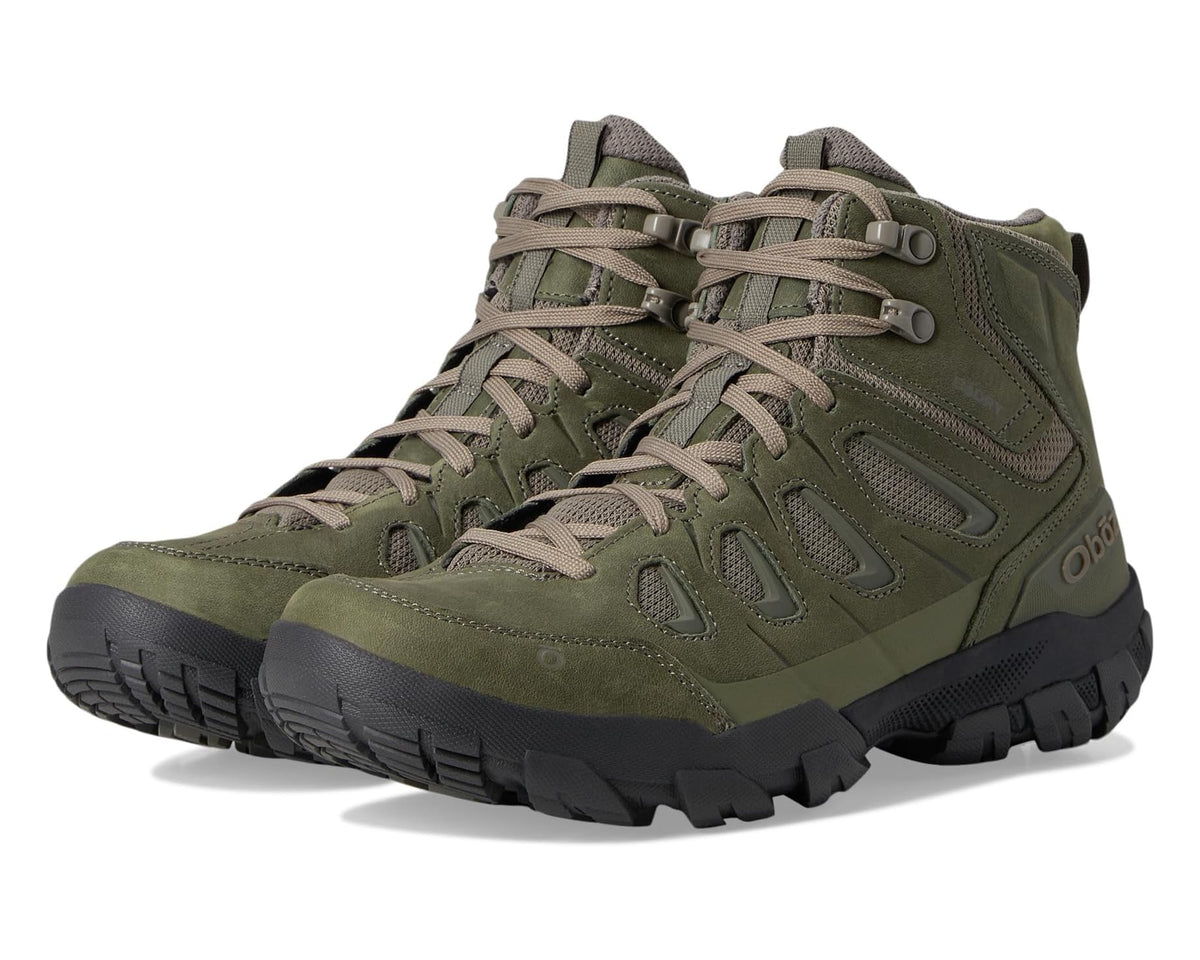 Olive green mid-top hiking boot, lace-up with padded collar and rugged tread outsole.
