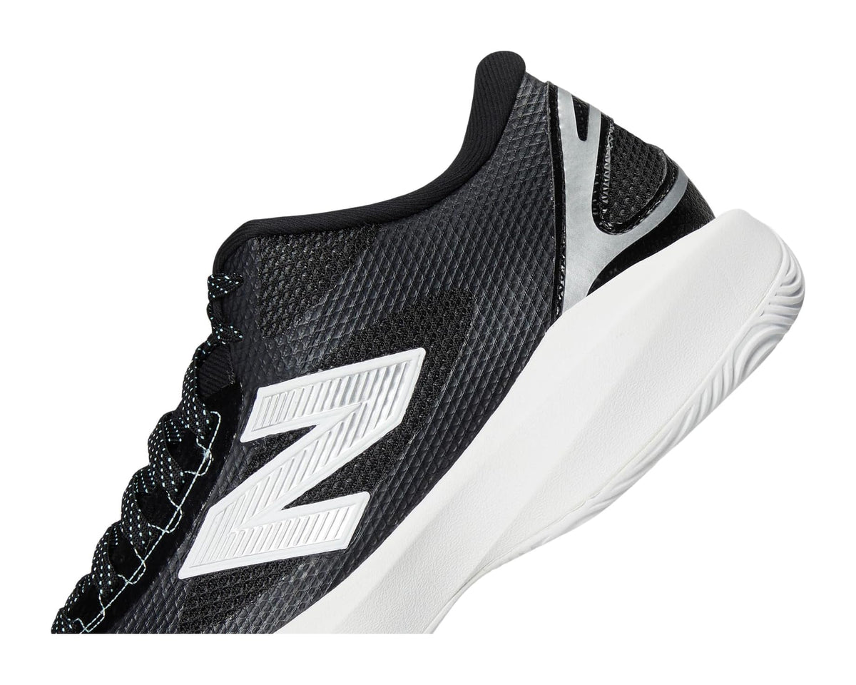 Men's box lacrosse cleats upper detail, black textured fabric with white logo patch