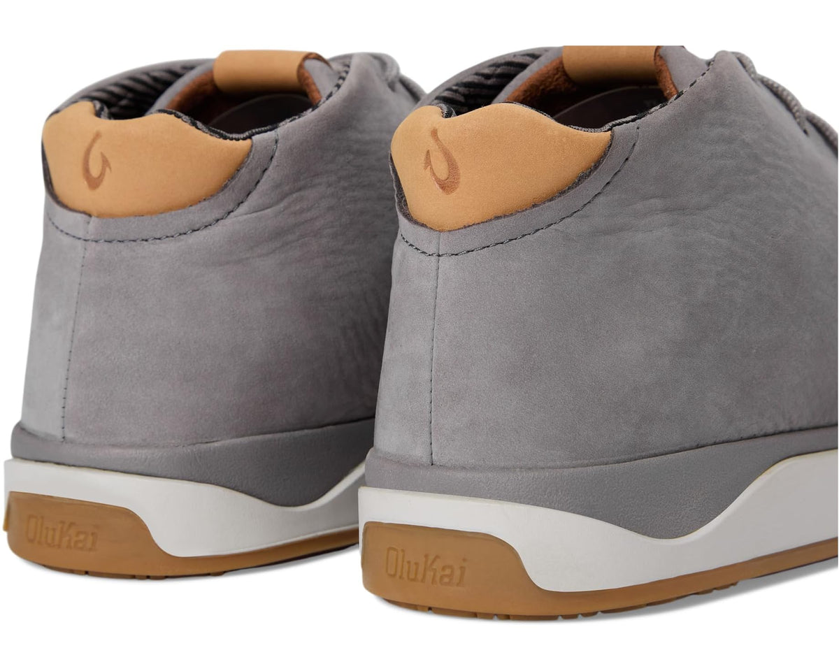 Pair of Graphite suede chukka boots, rear view with tan heel branding and gum sole