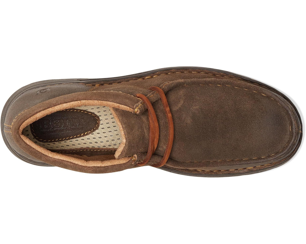 Taupe suede chukka boot with lace-up closure and visible cushioned interior